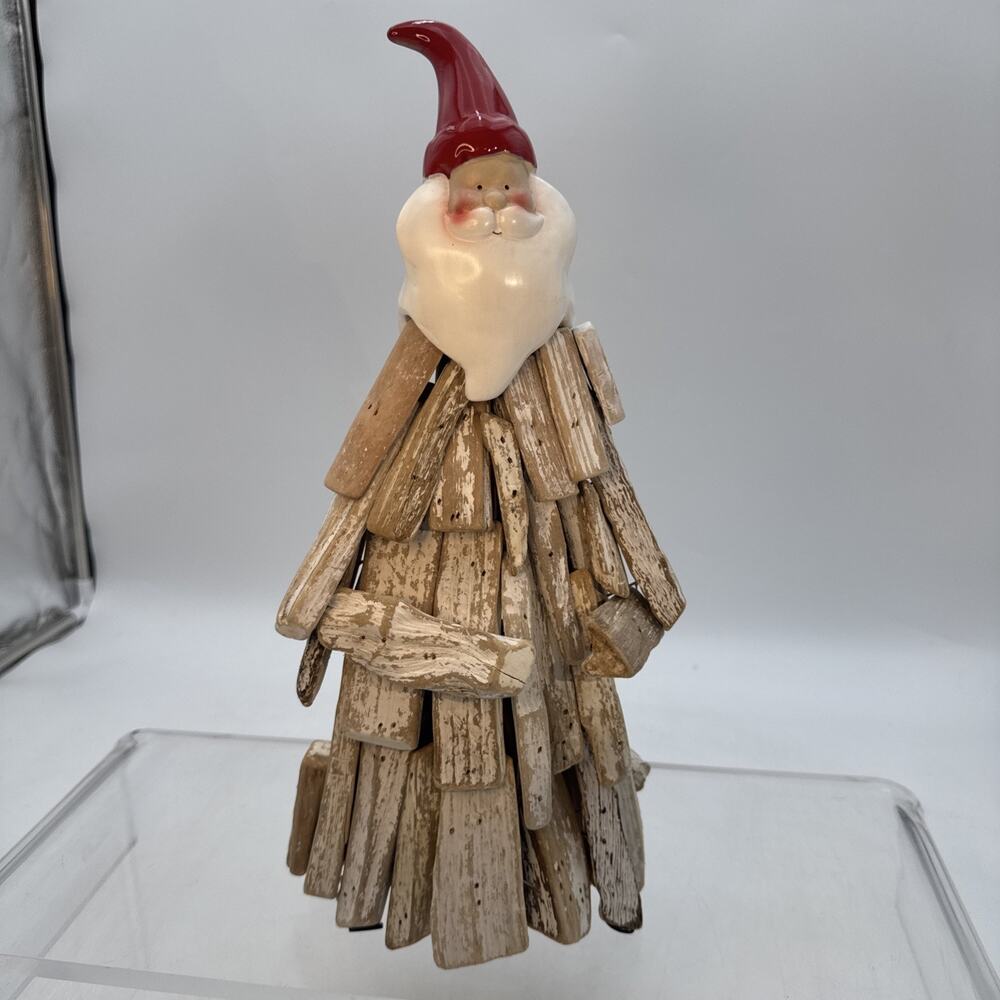 Rustic Holiday Figurine, resembling a handcrafted Driftwood/Ceramic Santa Claus